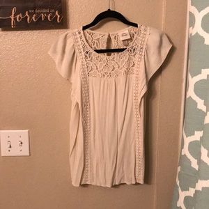 Cream blouse with lace embellishments